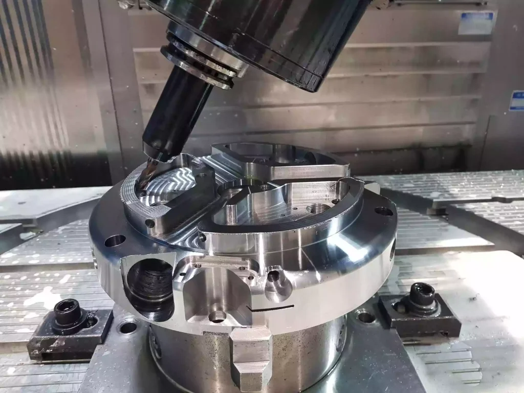 The Ultimate Guide to CNC Milling: Principles, Machinery, and Designing for Success 3 An advanced CNC milling system equipped with additional rotational axes, enabling multi-angle cutting and machining of complex geometries in a single setup. The image highlights the flexibility of modern milling operations for producing precision components with improved accuracy, efficiency, and reduced repositioning requirements.