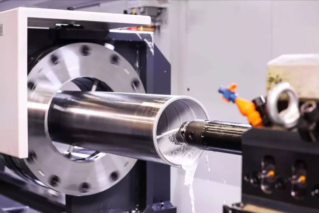 What is CNC Drilling? 2 A deep hole drilling machine using a long gun drill tool to create precise, high-depth holes in metal components. The image highlights the specialized tooling and controlled drilling process required for deep-hole applications, where accuracy, straightness, and surface quality are critical.