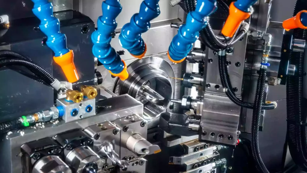 Understanding CNC Swiss Machining: Core Principles, Process Boundaries, and Design Specifications 1 A comparison between Swiss-type machining and conventional CNC turning, showing the different workpiece support and movement methods. The image highlights how Swiss machining uses a sliding headstock and guide bushing to minimize workpiece deflection, while conventional turning holds the workpiece in a fixed chuck for cutting operations.
