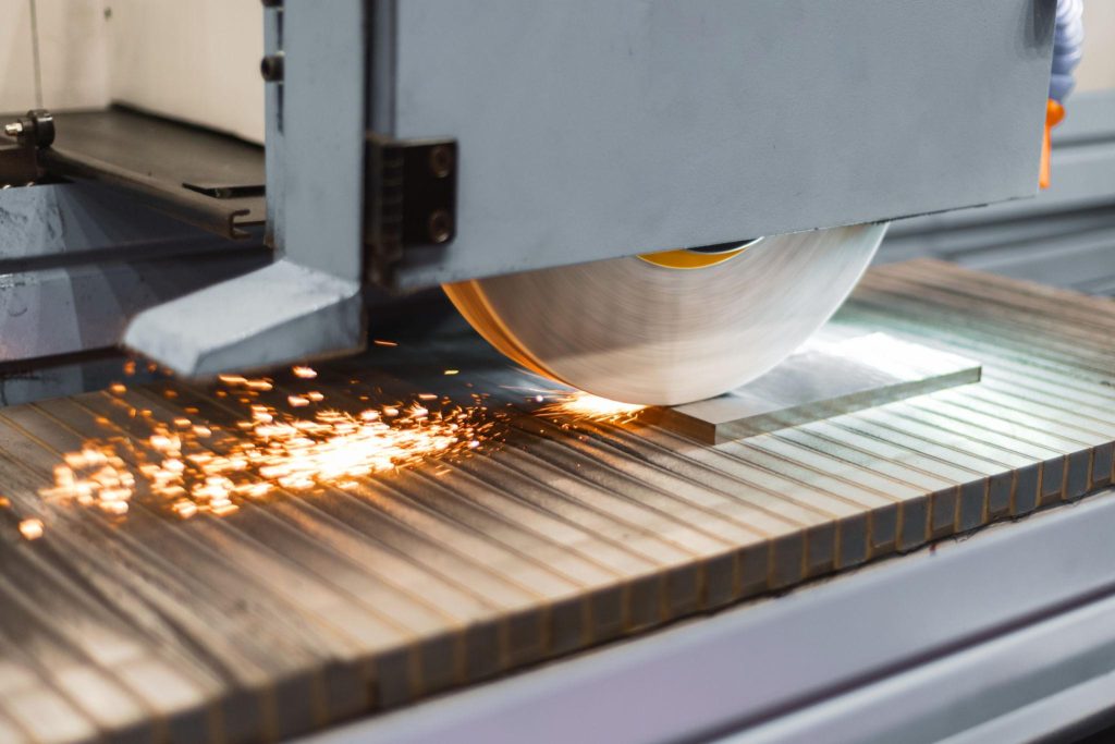 Ultimate Guide to CNC Grinding: Precision and Mechanics 1 A CNC surface grinding machine removes microscopic amounts of material while coolant controls heat and maintains dimensional accuracy.