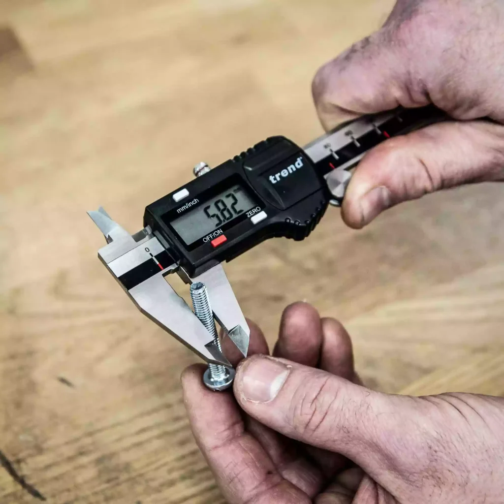 How to Measure Thread Size? 3 Digital caliper measuring the outside diameter of a threaded bolt to determine thread size accurately.