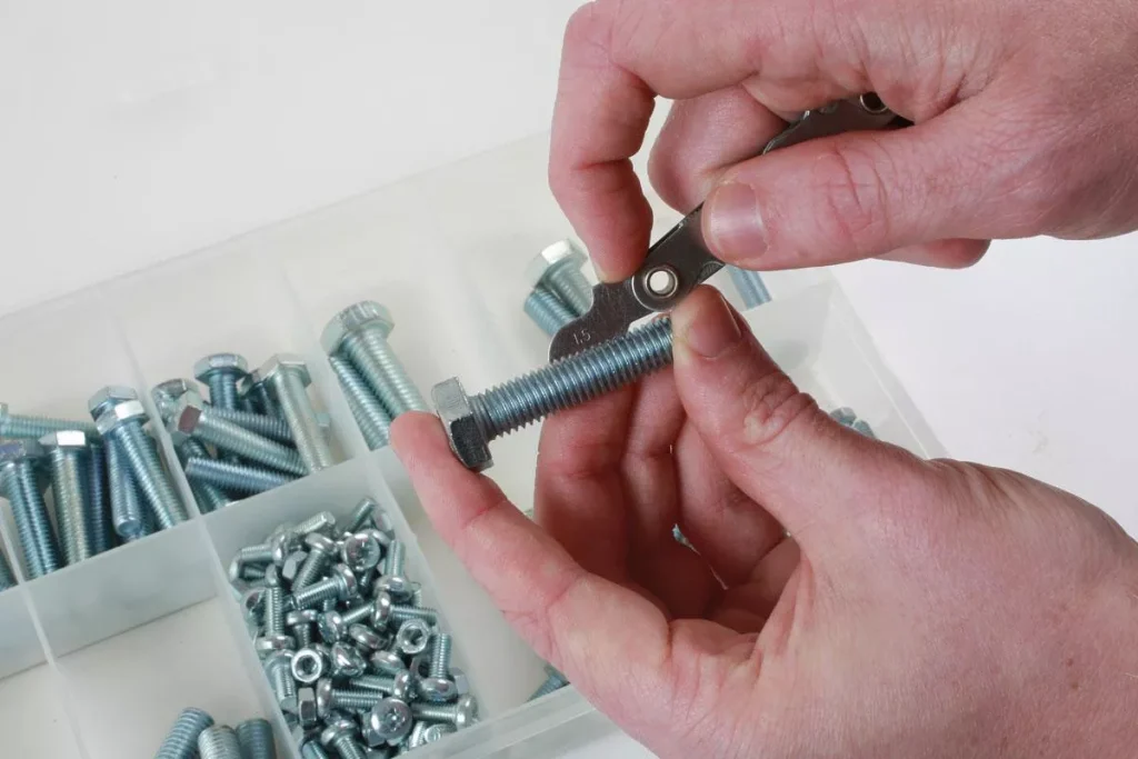 How to Measure Thread Size? 2 A thread pitch gauge being used to match the teeth with a bolt thread profile to identify thread pitch or TPI.