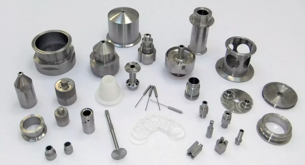 Easy-to-Machine Metals for CNC Machining 3 Showcasing a variety of finished CNC-machined metal products, including aluminum housings, brass fittings, steel shafts, copper connectors, precision brackets, and mechanical components.